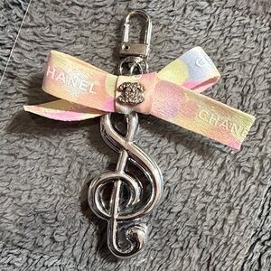 Bag Charm with treble clef and bow.
